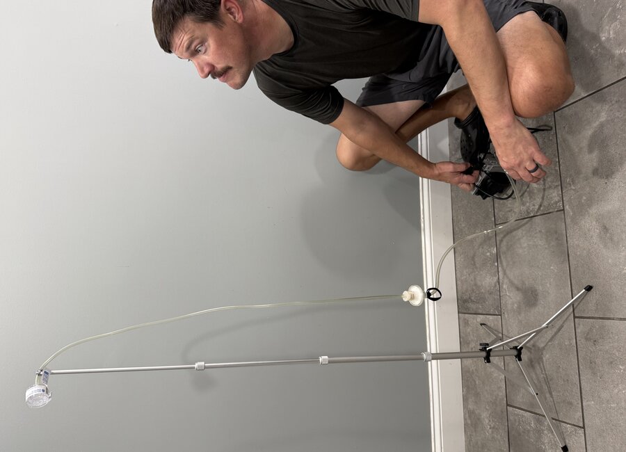 Air sampling pump set up during an indoor assessment