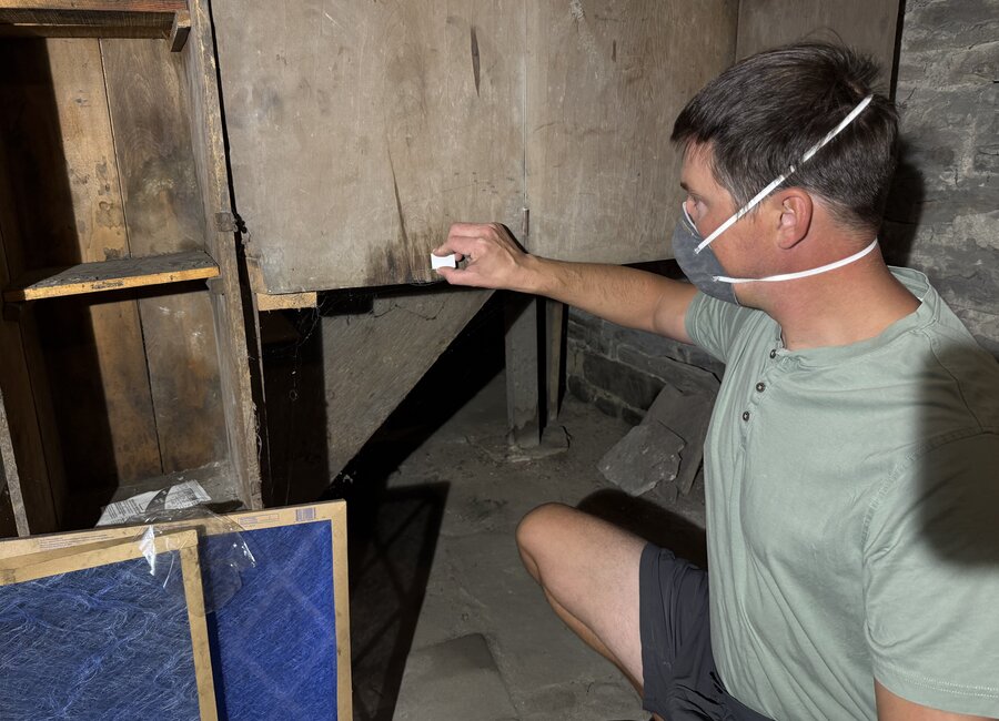 Collecting a surface sample during a crawlspace inspection