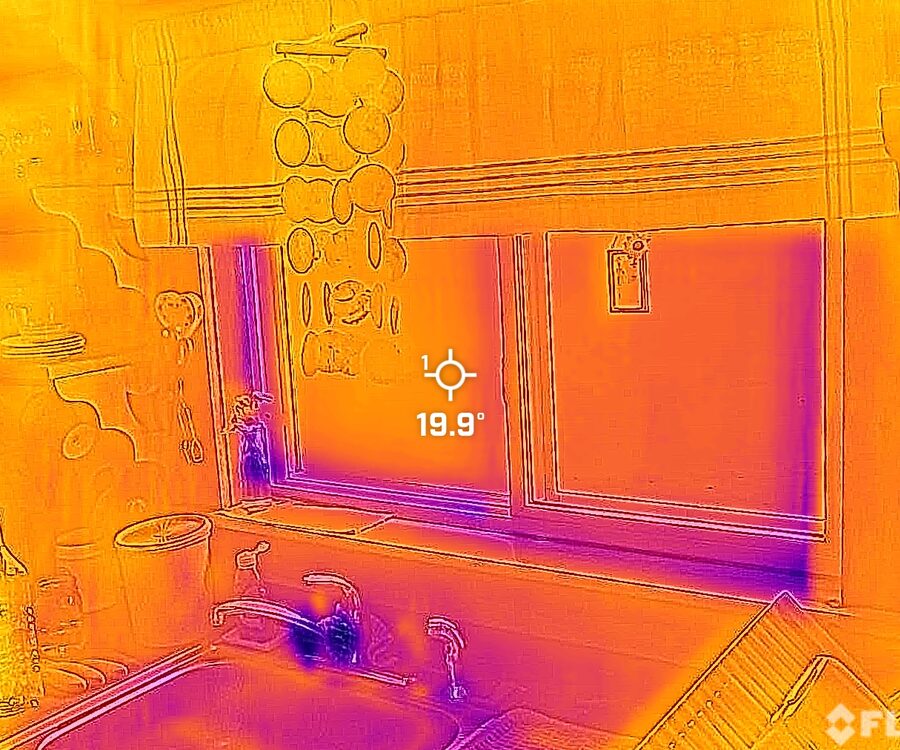 Thermal imaging scan of a kitchen window and wall, taken during an on-site assessment